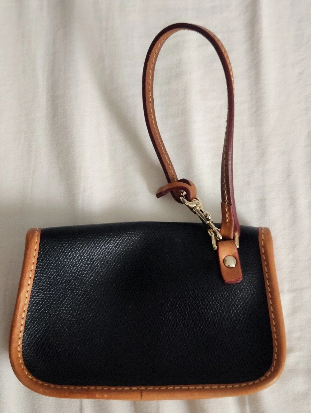Dooney and Bourke Pebbled Leather Bristol Pouch with Clip Black w Brown Trim